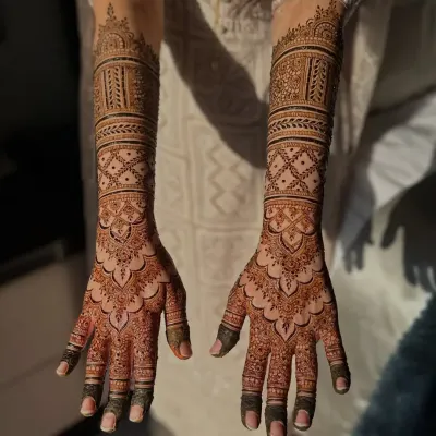 A complete bridal look, this design extends up the arms with symmetrical patterns. I use fine lines and detailed fillers to create a stunning effect that looks beautiful both in person and in photos.