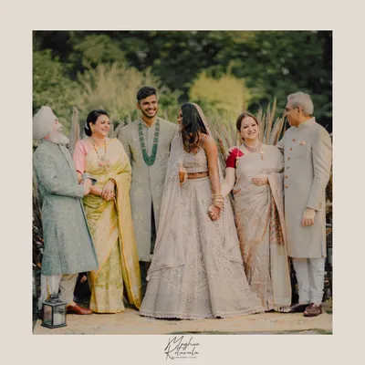 A beautiful family portrait from a wedding shoot we styled and conceptualized. We chose a coordinated color palette of ivory, beige, and soft metallics to create a look of understated elegance for the entire family.