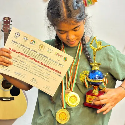So proud of my student showing off her trophy and medals from the District Yogasana Sports Championship. Her hard work and dedication are truly inspiring.