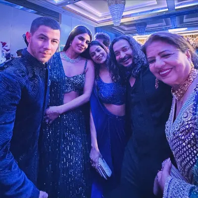 A night to remember! Sharing a moment with Priyanka Chopra, Nick Jonas, and Dr. Madhu Chopra after performing at a very special wedding sangeet.