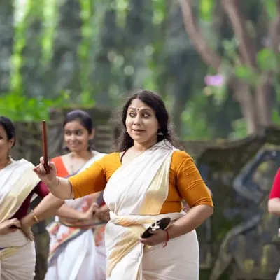 A moment of instruction during our 'Upaasanaa' workshop. Here, our Guru, Vinaya Narayanan, guides students through the finer points of movement, ensuring personalized attention and a deep understanding of the form.