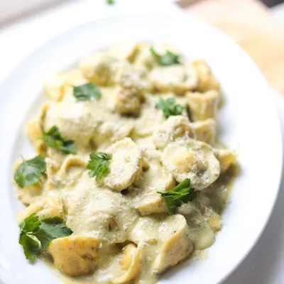 A creamy tortellini dish, perfectly cooked and plated. In our Italian classes, you learn to make both the pasta and the sauce from scratch.