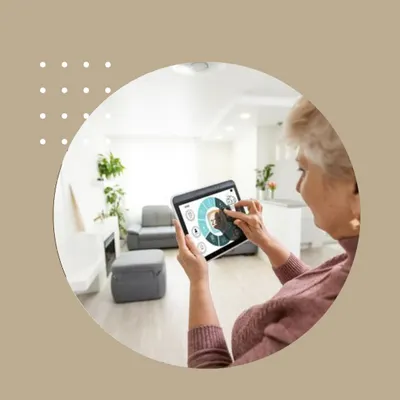 We design our smart home interfaces to be accessible for all ages. Here, an elderly user easily interacts with her home's systems via a tablet with a large, clear display, allowing her to control lighting, security, and climate with a simple touch.