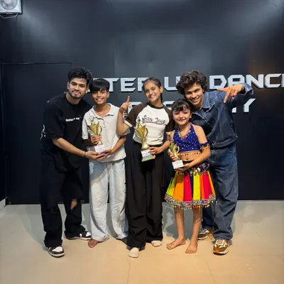 Celebrating our competition winners. Seeing students of all ages holding trophies is the best reward for a teacher.