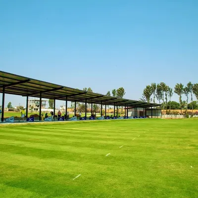 Our covered driving range allows for uninterrupted practice, rain or shine. With numerous bays available, you can focus on your long game and see the full flight of your ball across the lush green fairway.