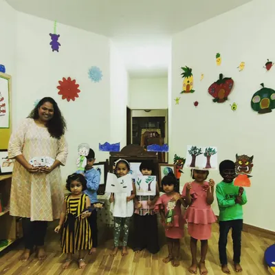 After a story about nature, the children and I pose with the character and scene props they created. This 'make and take' activity reinforces the story's themes and gives them a sense of accomplishment.