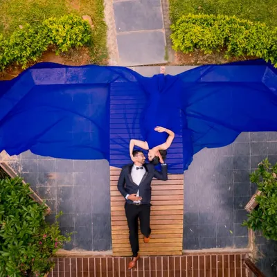This top-down drone shot is one of my signature styles. It allows us to use the flowing gown to create incredible shapes and patterns, resulting in a photo that is truly a piece of art.