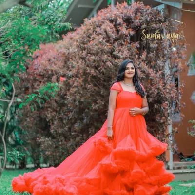 This vibrant red frill gown is available for rent and is a showstopper for any outdoor maternity or pre-wedding shoot.