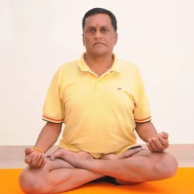 The classic Padmasana, or Lotus Pose. Achieving stillness and correct posture in this asana is a primary step before beginning any yogic breathing techniques.