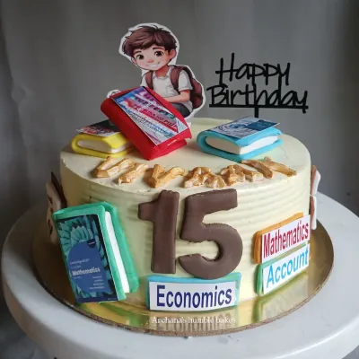 A cake for a young student celebrating their 15th birthday. It's decorated with his favorite subjects: Mathematics, Accounts, and Economics.