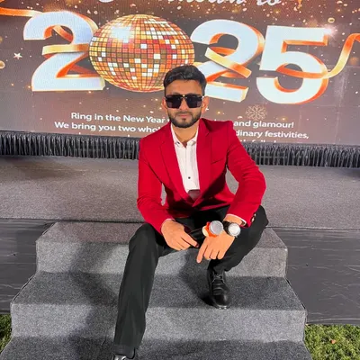 Taking a seat on the stage for the New Year's 2025 celebration. As a stage show host, I'm comfortable in any event setting, ready to bring the glamour and excitement.