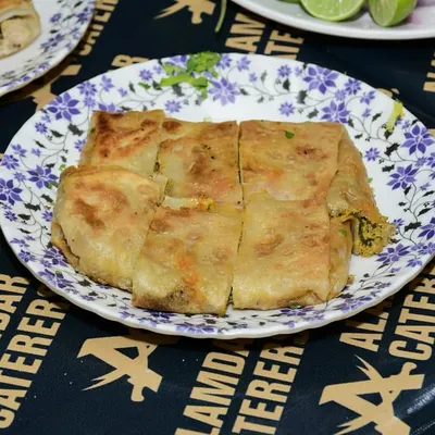 A delicious Baida Roti, quartered and ready to be served. A glimpse from Day 5 of our food festival.