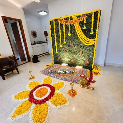 A complete view of a traditional Annaprashan ceremony setup. I used a faux grass wall panel, marigold garlands, brass diyas, and a handmade flower rangoli to create a sacred and photogenic space for the baby's first meal.