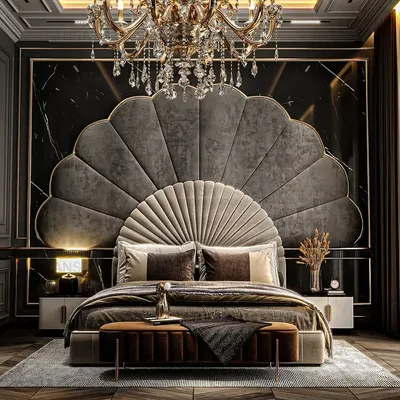 This bedroom is a masterclass in dramatic elegance. The magnificent fan-shaped headboard in grey velvet creates a stunning focal point, perfectly complemented by the crystal chandelier and dark, moody wall panels. It's a space designed to make you feel like royalty.