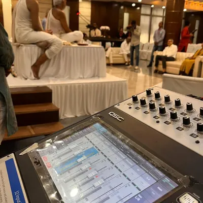 Here I am at the helm of a QSC TouchMix 30 Pro, ensuring perfect sound balance for a religious event with high-profile speakers. This is how I guarantee a technically perfect event.