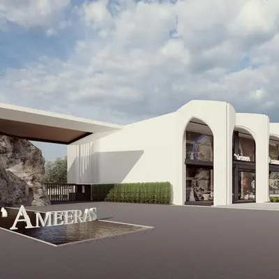A successful township requires more than just beautiful homes; it needs integrated commercial and social spaces. The commercial block at Ameeras features a modern design with classic arches, providing residents with convenient access to amenities while maintaining the community's sophisticated aesthetic.