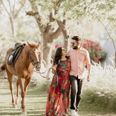 A romantic stroll with a majestic companion. This pre wedding shoot for Dixit and Tanya combined their love for nature and animals, creating a fairytale like setting that was both unique and personal.