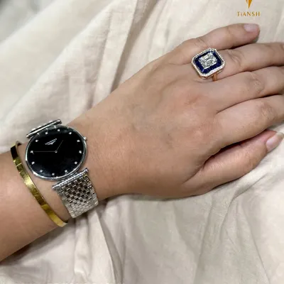 Minimal does not have to mean plain. I love showing my clients how to elevate their basics by pairing a watch with a clean cuff and adding a bold ring for a pop of color and character.