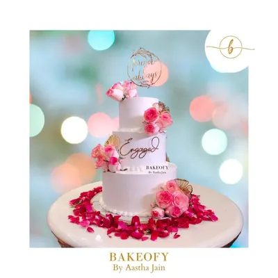 This three-tier fresh fruit cake was for a beautiful engagement ceremony. The design is clean and elegant, with fresh pink roses and delicate pearl details, all surrounded by a bed of rose petals. It felt surreal to be part of such a special day.