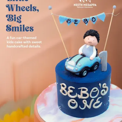 Little wheels, big smiles. This fun car-themed cake is perfect for a first birthday, featuring a cute fondant boy in his convertible.
