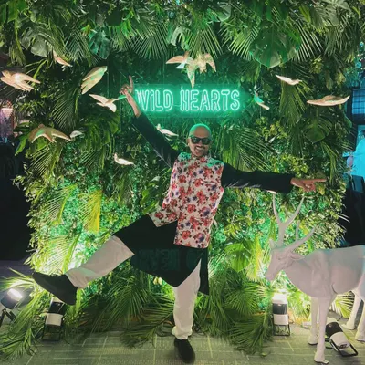 When life gives you a neon jungle, you strike a pose. Capturing the 'Wild Hearts' theme at a recent event. It's all about matching the vibe of the party.