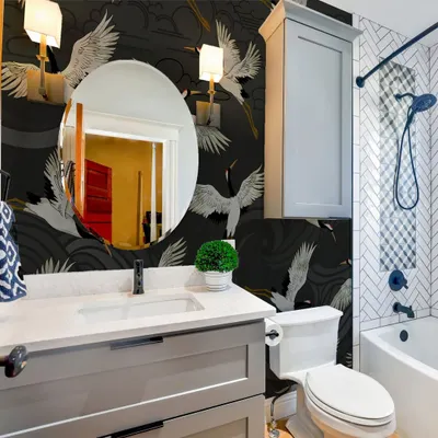 Our Japanese Flying Cranes in Sea Storm wallpaper adds a touch of drama and sophistication to this bathroom. The design is both powerful and serene, making a bold statement.