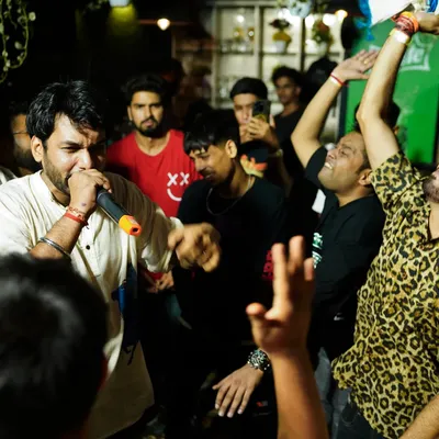 The crowd and the artist feeding off each other's energy during a rap cypher. This is what our community events are all about, creating a space for raw, authentic performances.