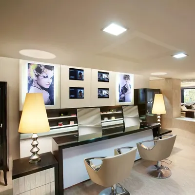 Our styling stations are designed for both function and luxury. With clean lines, professional lighting, and comfortable seating, this is where our stylists craft your personalized look.