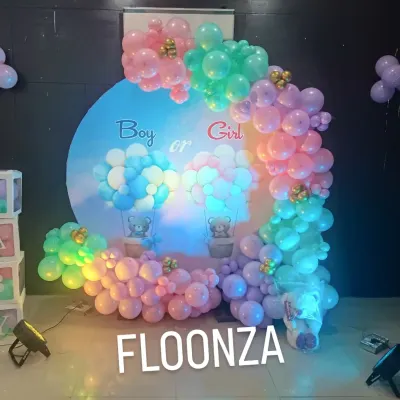 This "Boy or Girl" gender reveal backdrop is a popular choice. I use a mix of pink, blue, green, and purple balloons to create a whimsical feel, complete with cute teddy bear details and hot air balloon graphics on the main circular panel.