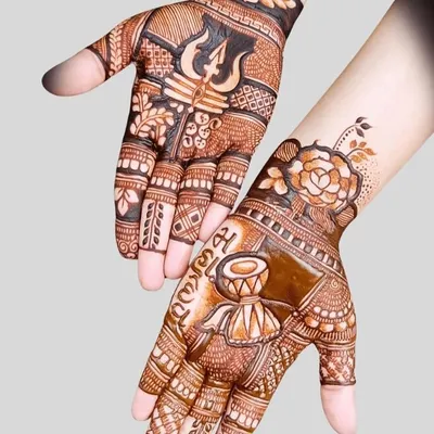 A powerful Sawan special design featuring Lord Shiva's Trishul and Damru. This kind of devotional art is very popular during the holy month.