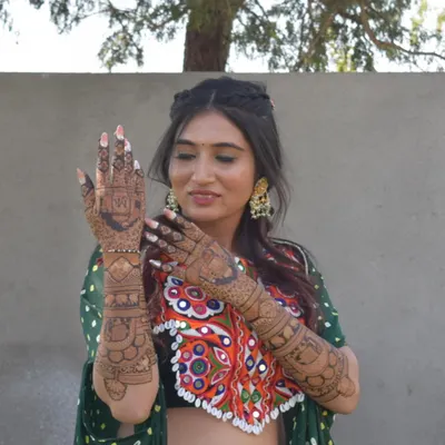 As a mehndi artist, I had always dreamed of my own bridal henna. Here I am on my mehndi day, so happy with how my vision came to life.