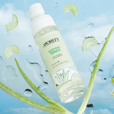 A refreshing shot of an aloe vera toner appearing to float against a sky backdrop with water splashes. We use creative editing and composition to create magical, eye-catching skincare visuals.