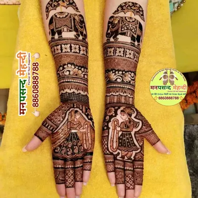 This full bridal design features classic dulha-dulhan portraits and elephant motifs, telling a story on the bride's hands.