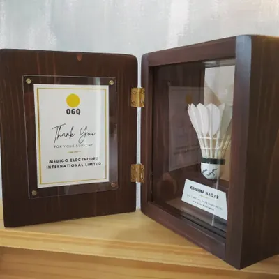 We were so honored to design this special series of shadow boxes for the Olympic Gold Quest (OGQ) to celebrate para-badminton player Krishna Nagar. The box preserves an autographed shuttlecock.