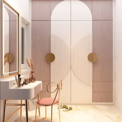 A dressing room should feel like your personal sanctuary. This space combines soft lighting, elegant textures, and artistic wardrobe doors to create a corner where style and confidence begin.