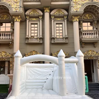 The stunning architecture of our All-White Dream Castle set against a beautiful venue. Its clean lines and grand size make it a statement piece for any upscale children's party or event.