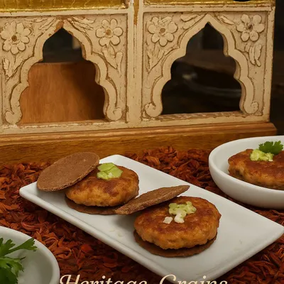 This is not your regular Galouti kebab. We've reimagined this classic dish with a mysterious blend of spices and served it on a wholesome grain cracker instead of the usual roti, perfectly blending heritage with modern indulgence.
