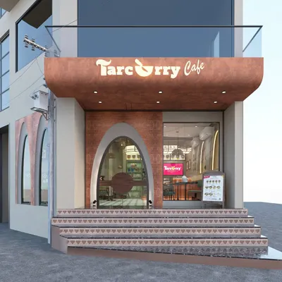The inviting facade of Tarcurry Cafe, featuring a unique arched entrance with brick and textured finishes that hint at the traditional Odia culture within.