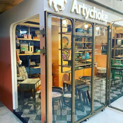 The doors to my Artychoke store are open. I designed the space to feel like a gallery, with glass doors and carefully arranged displays that invite you to explore the world of my art-infused furniture.