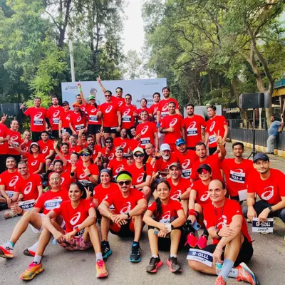 The full squad. A large group photo of our ASICS Running Club members after the Gel Kayano 31 launch run, showcasing the size and energy of our community.