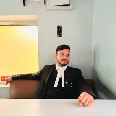 Seated in my office, ready for a client meeting. My focus is always on the goal, and I believe success is the direct result of hard work and passion.