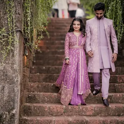 A grand, fairytale entrance. This couple looks regal in their matching lavender traditional outfits during their engagement shoot.
