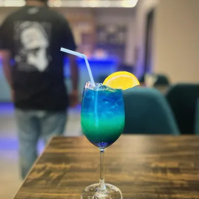 This is my Tropical Lagoon mocktail. Its beautiful blue and green layers and citrus garnish make it a refreshing escape in a glass, perfect for a warm Bangalore afternoon.