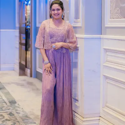 I styled singer Priyanka Barve in this chic pastel lavender jumpsuit with a matching embellished cape for an event in Pune. It's a modern, sophisticated, and comfortable alternative to traditional wear.