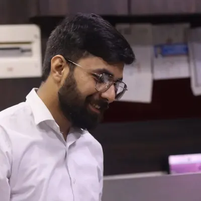 A candid moment in the office. Even during the most stressful days, finding a reason to smile helps keep things in perspective.