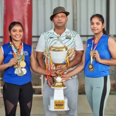 I am incredibly proud of my female boxers. Here I am with two of my students, celebrating their victory with a championship trophy and their hard earned medals from a major tournament.