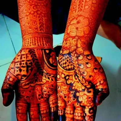 This is the result of using pure, natural henna. The stain is a deep, rich reddish-brown, showing the intricate details of the elephant and floral design beautifully.