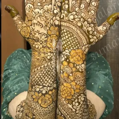 A stunning example of full coverage bridal mehendi, with a mix of floral, paisley, and geometric patterns for a rich and traditional look.