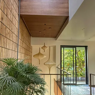 A feature wall of exposed brick in our project, "The Brick Affair". The natural texture and color variation of the bricks add immense warmth and character to this staircase area.