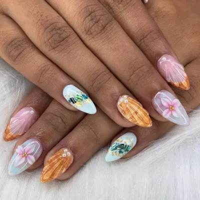 This is my specialty, FiDi art. I created these textured seashells and 3D flowers to bring a beach vacation right to your fingertips. It's a detailed and unique style.